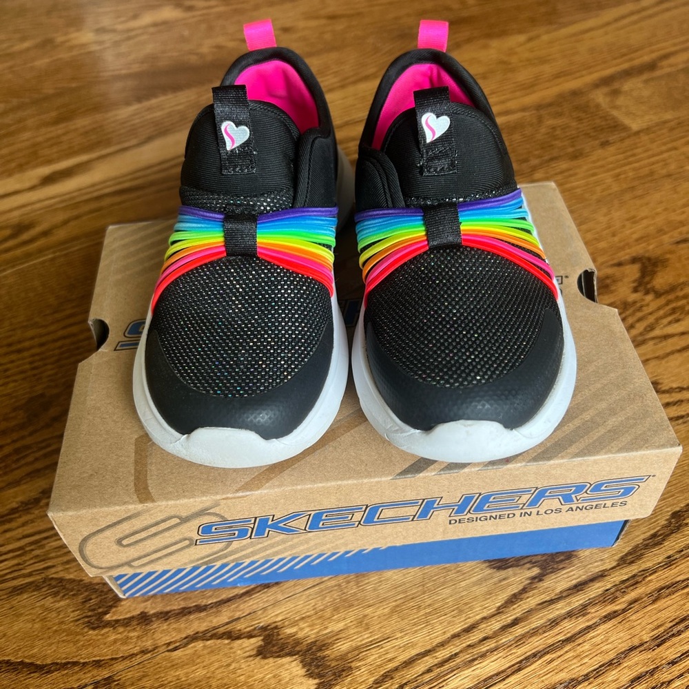 Skechers girl shoes. size 1. Color: Black and rainbow w/ Sporty Slip-On Design.